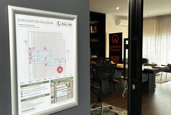 Evacuation diagram displayed near the entrance of a Queensland workplace