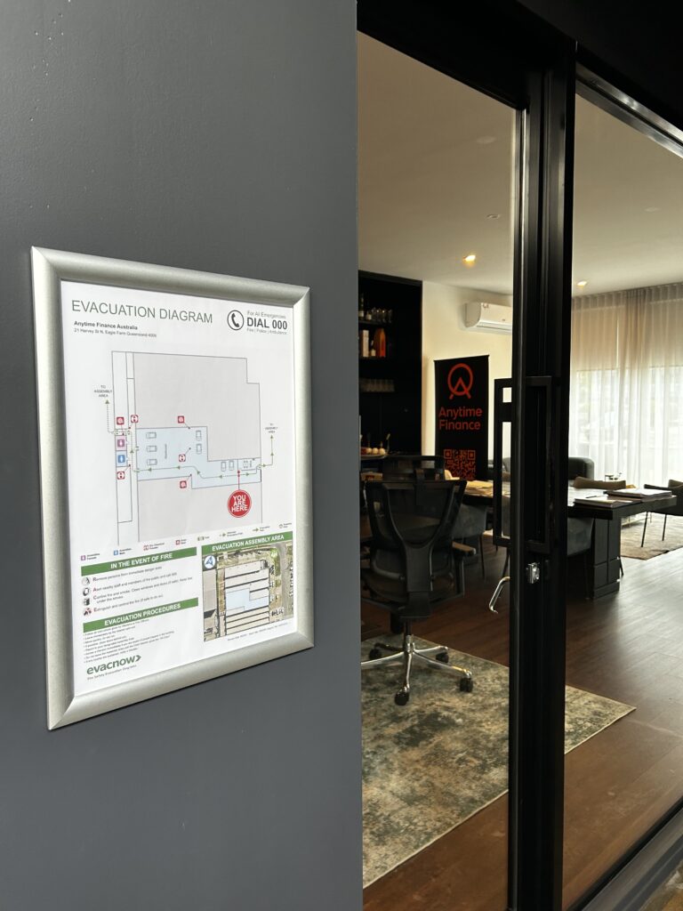Evacuation diagram displayed near the entrance of a Queensland workplace