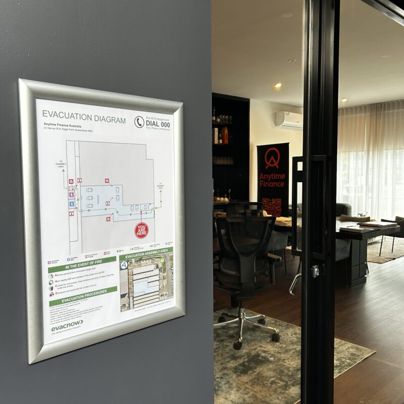 Evacuation diagram displayed near the entrance of a Queensland workplace